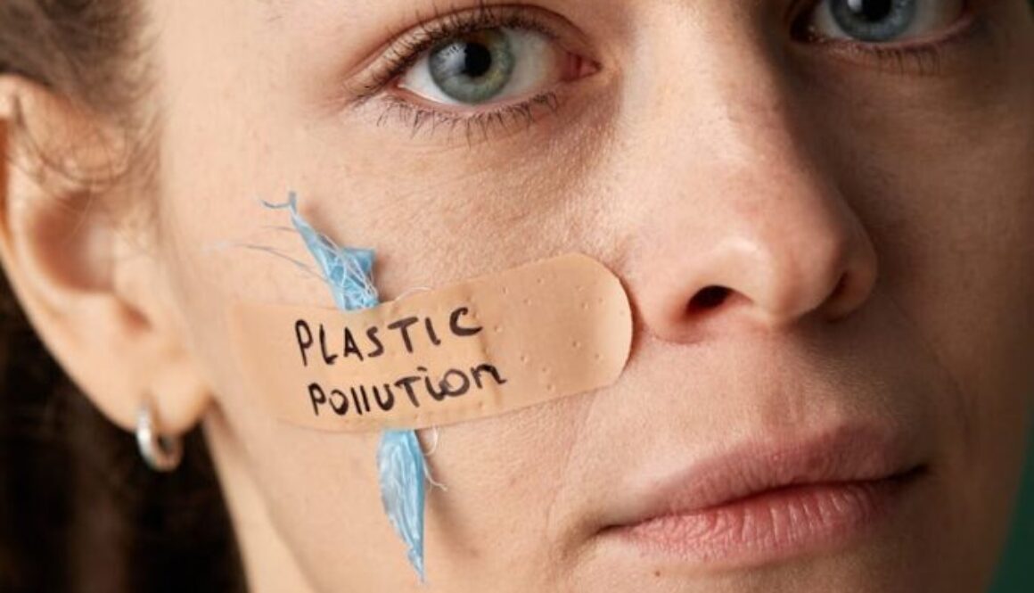 woman-with-a-band-aid-on-her-cheek-saying-plastic-pollution-6995471/