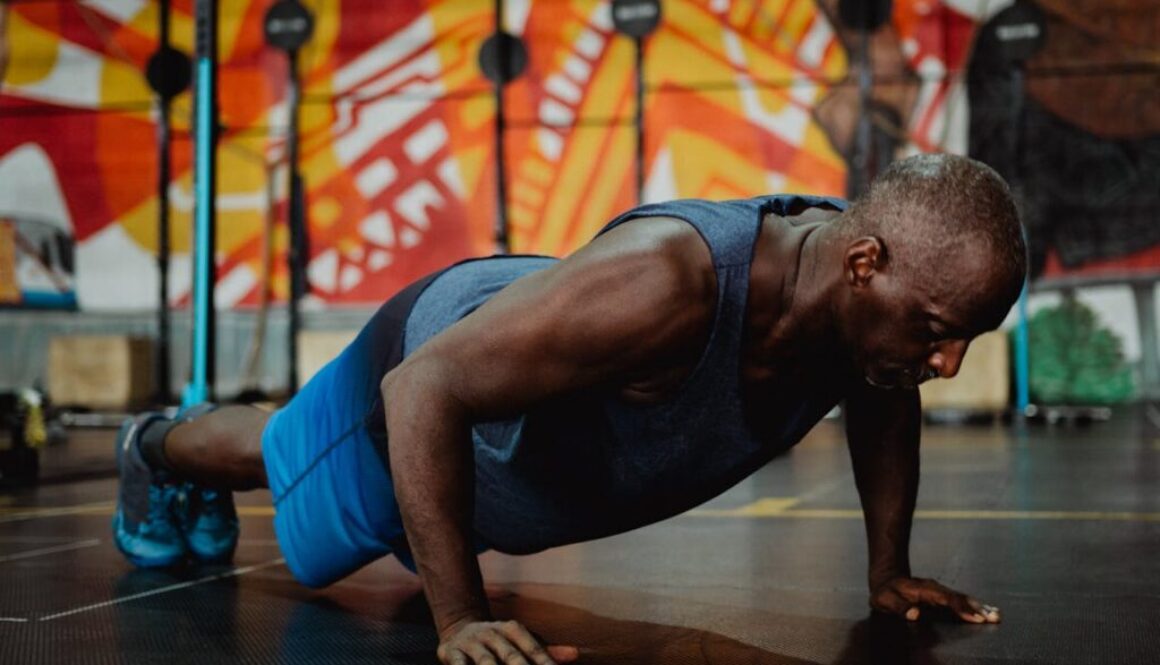 a-man-in-gray-tank-top-doing-push-ups-4720291/