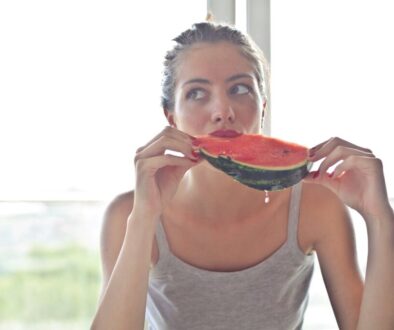 woman-in-gray-tank-top-holding-watermelon-768454/