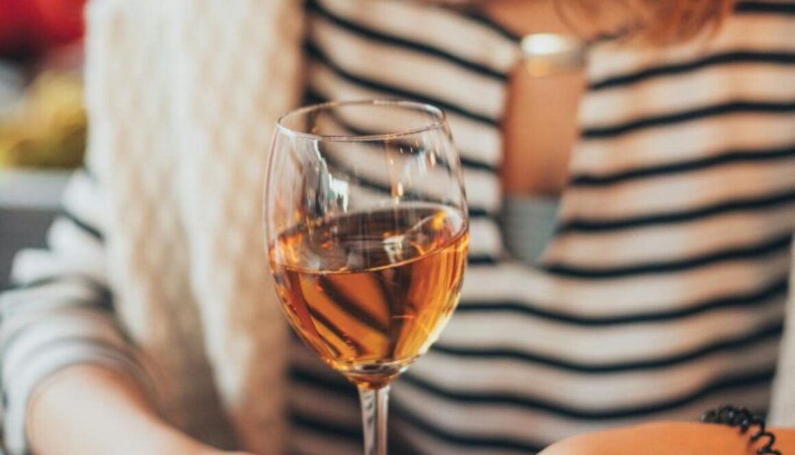 woman-holding-glass-of-wine-1927313/